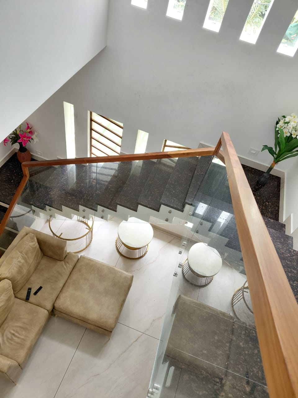 Top view of a staircase with glass panels